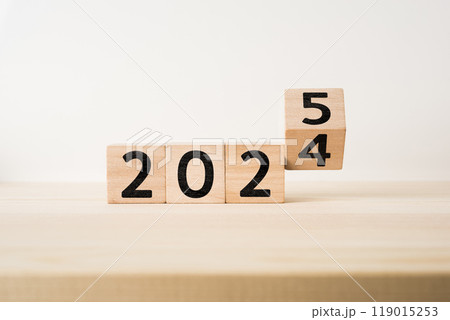 floating fly wooden cube with word 2025 and 2024 119015253