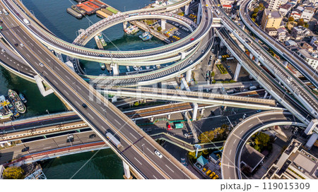 Aerial view highway and overpass Osaka City, Junctions of city highway vehicles drive on roads Osaka City, Japan, Highway interchange, Expressway important infrastructure, Osaka City, Japan. 119015309