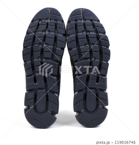 Sole of blue light summer sneakers. Blue summer sneaker made of mesh fabric, with a thick sole, isolate on a white background. Sole of blue light summer sneakers. Blue summer sneaker made of mesh fabric, with a thick sole, isolate on a white background. 119016748