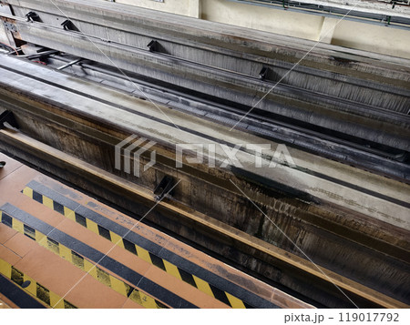 A long metal train tracks at a monorail station A long metal train tracks at a monorail station 119017792