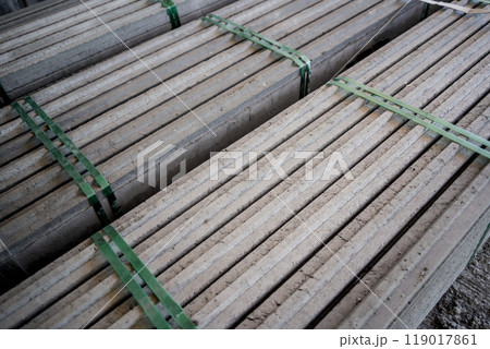 A large stack of concrete slabs on a construction site 119017861