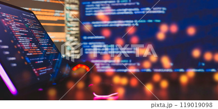 Working atmosphere of a programmer at home, IT business. Monitor closeup of function source code. Project managers Working atmosphere of a programmer at home, IT business. Monitor closeup of function source code. Project managers 119019098