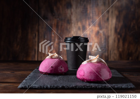 Coffee and cake. Serving coffee and sweets. Coffee in a craft glass. Black coffee and pink cakes. 119021150