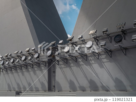 Large outdoor LED flood lights spotlights shine for the bridge at night illuminated on Bridge foundation post. 119021321