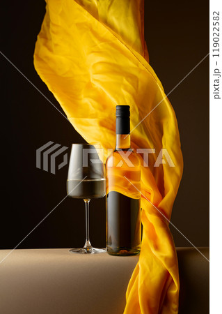 White wine and flutters of yellow cloth. 119022582