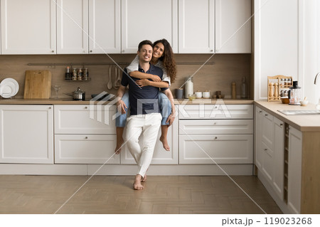 Happy young married couple posing for home portrait Happy young married couple posing for home portrait 119023268