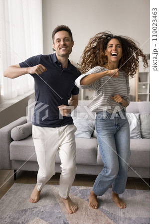 Joyful positive young married couple having fun at home Joyful positive young married couple having fun at home 119023463