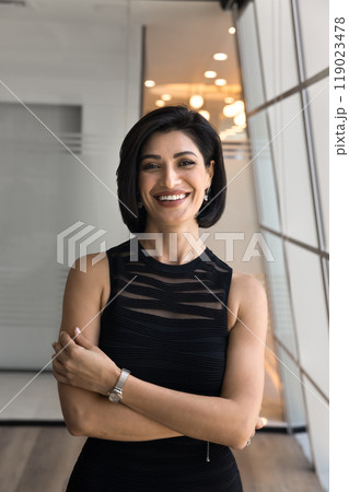 Cheerful beautiful young entrepreneur woman in casual keeping arms crossed Cheerful beautiful young entrepreneur woman in casual keeping arms crossed 119023478