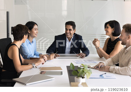 Happy middle aged Indian company director man holding meeting 119023610