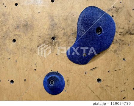 Close up a rock climbing wall. Fitness training in a gym. 119024759