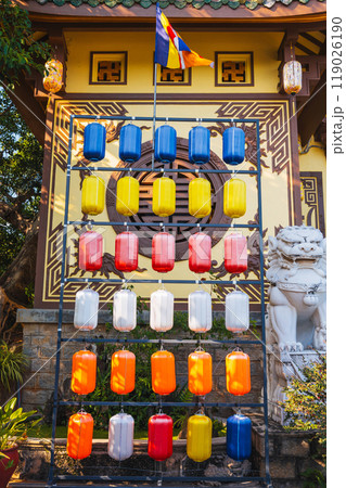 Colorful hanging Chinese lanterns decorate the wall at the Buddhist pagoda in Vietnam in Asia for holiday 119026190