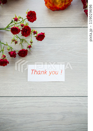 wooden light background with white and pink roses 119029696