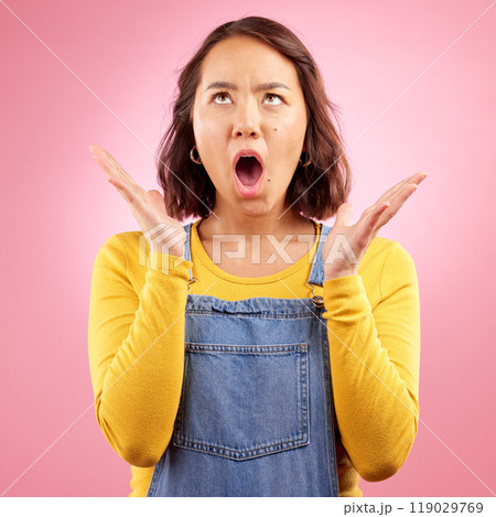 Surprise, news and asian woman with wow face in studio for deal, offer or promo on pink background. Omg, wtf and Japanese lady with open mouth shock emoji for coming soon, discount or sign up sale 119029769