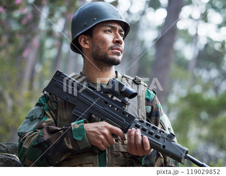 Veteran, army and man with gun for forest training, outdoor shooting range and military mission, search and focus. Rifle, soldier or young person in woods or nature with battlefield gear and vision 119029852