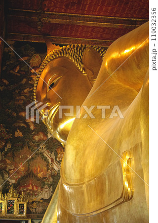 Reclining golden Buddha statue in Bangkok, Thailand. Thai statue of reclining Buddha Reclining golden Buddha statue in Bangkok, Thailand. Thai statue of reclining Buddha 119032356