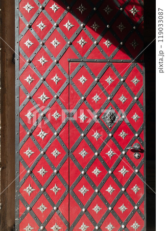 Medieval door with forged elements. Entrance to the historical building located on Knights of the Cross Square, Old Town, Prague, Czech Republic. 119033087