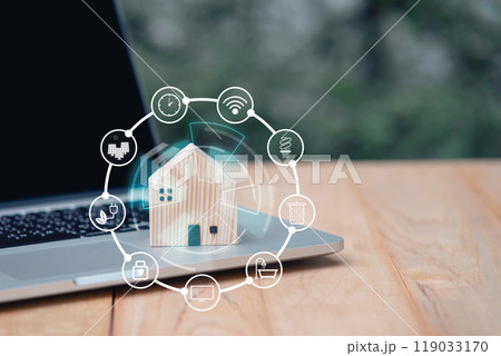 House wooden model and icons on computer laptop with copy space. Loan real estate or property mortgage investment concept. natural environment house. House wooden model and icons on computer laptop with copy space. Loan real estate or property mortgage investment concept. natural environment house. 119033170