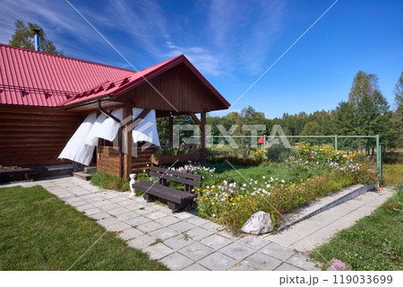 Serene Wooden Cabin Retreat Under Blue Sky Serene Wooden Cabin Retreat Under Blue Sky 119033699