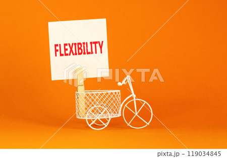 Flexibility symbol. Concept word Flexibility on beautiful white paper on clothespin. Beautiful orange background. Beautiful miniature white bicycle. Business flexibility concept. Copy space. 119034845