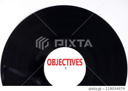 Objectives symbol. Concept word Objectives on beautiful black white vinyl disk. Beautiful white background. Business objectives concept. Copy space. 119034874
