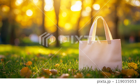 Eco bag mockup on green grass in a park 119035053