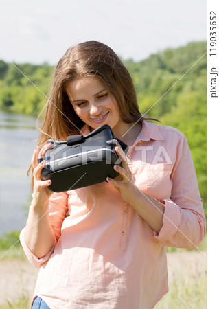 Girl with virtual reality glasses 119035652
