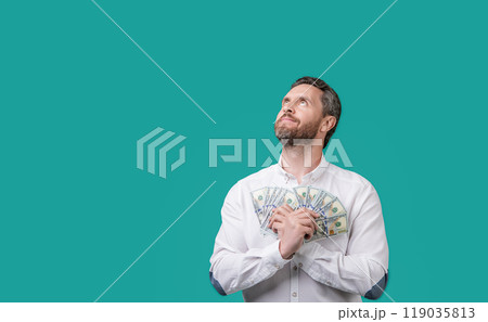 millionaire hold money in studio, advertisement. millionaire holding money cash. 119035813