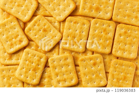 Cheese crackers background, crispy and crunchy cheese crackers, taken from above, close up. Cheese crackers background, crispy and crunchy cheese crackers, taken from above, close up. 119036383