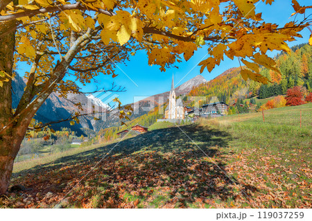 Amazing autumn landscape  at Heiligenblut with St Vincent Church near Grossglockner mount . 119037259