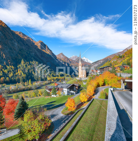 Picturesque autumn landscape at Heiligenblut with St Vincent Church near Grossglockner mount . Picturesque autumn landscape at Heiligenblut with St Vincent Church near Grossglockner mount . 119037273