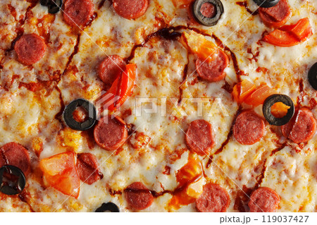 Freshly baked pepperoni pizza, generously layered with olives and tomatoes, emerges golden and crispy, inviting everyone to indulge in a delightful culinary experience. Freshly baked pepperoni pizza, generously layered with olives and tomatoes, emerges golden and crispy, inviting everyone to indulge in a delightful culinary experience. 119037427