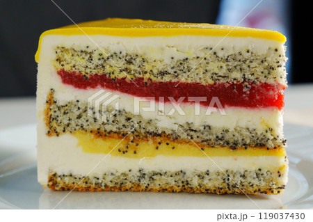This delightful treat celebrates layers of poppy seed cake, rich cream, and bright fruit jelly, inviting indulgence on a cheerful afternoon gathering. This delightful treat celebrates layers of poppy seed cake, rich cream, and bright fruit jelly, inviting indulgence on a cheerful afternoon gathering. 119037430