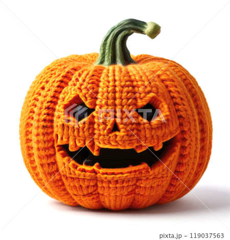 Crocheted soft toy close up photo. Halloween pumpkin. 119037563