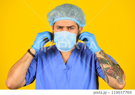 concept of healthcare. man doctor wear rubber gloves. nurse in respirator mask. medical test for vaccine. new virus immunity. coronavirus in China. epidemic is rapid spread of infection disease concept of healthcare. man doctor wear rubber gloves. nurse in respirator mask. medical test for vaccine. new virus immunity. coronavirus in China. epidemic is rapid spread of infection disease 119037769