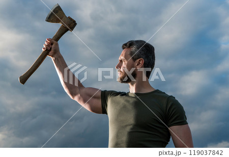 confident man with axe. free caucasian man hold ax. brutal man on sky background confident man with axe. free caucasian man hold ax. brutal man on sky background 119037842