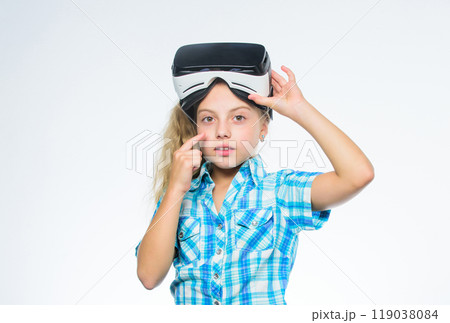 Digital future and innovation. Happy kid use modern technology. Little girl wearing virtual reality goggles. Little child in VR headset. Small child wear wireless VR glasses. New reality is here Digital future and innovation. Happy kid use modern technology. Little girl wearing virtual reality goggles. Little child in VR headset. Small child wear wireless VR glasses. New reality is here 119038084