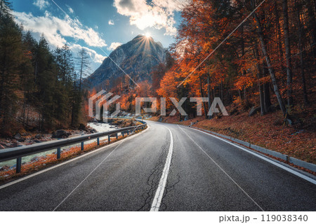 Winding mountain road at colorful sunset in golden autumn 119038340