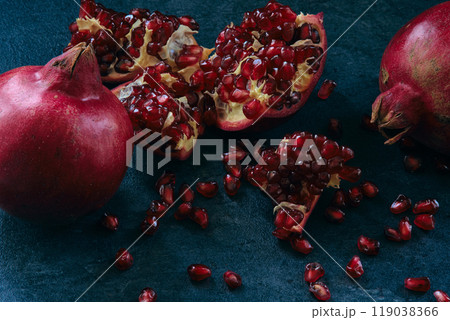 red ripe pomegranate fruits on dark background 119038366