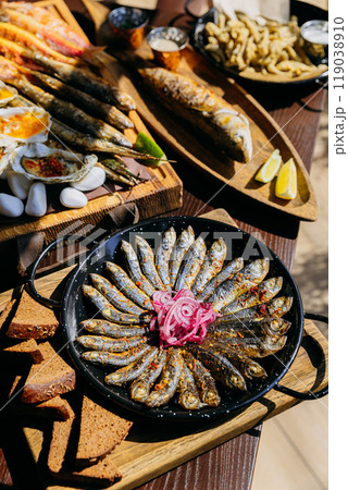 Delicious seafood assortment featuring grilled fish, sardines, oysters. Perfect for gourmet dinner 119038910