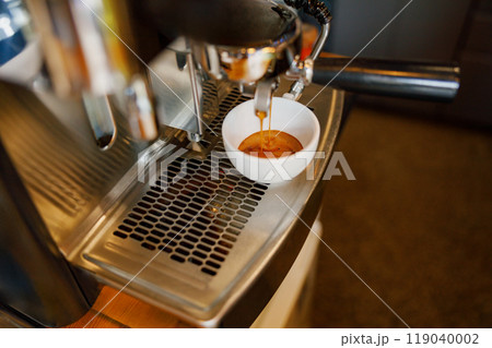 Espresso Extraction Process from Coffee Machine Situated in a Contemporary Modern Kitchen 119040002
