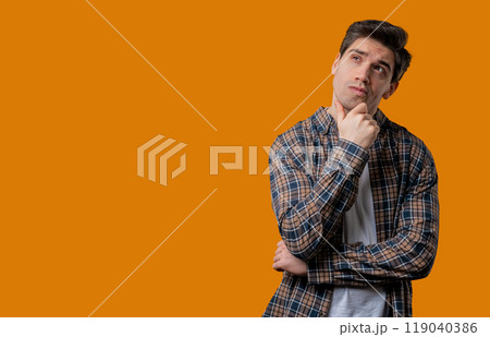 Thinking around mature man, yellow background. Smart student guy finding answer 119040386