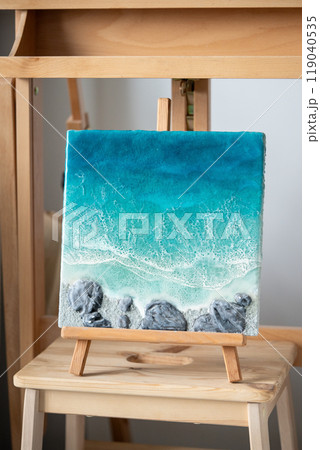 Hand-painted wooden board with blue sea waves, ocean, rocks made of epoxy resin. Fluid art  119040535