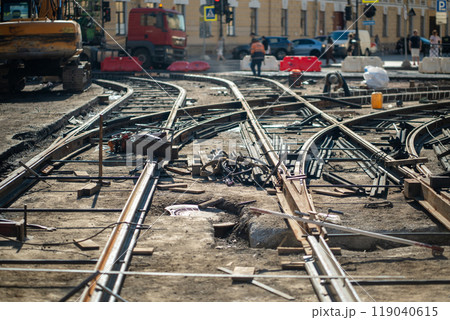 Construction site with scattered beams and rails, major tram track and asphalt replacement Construction site with scattered beams and rails, major tram track and asphalt replacement 119040615