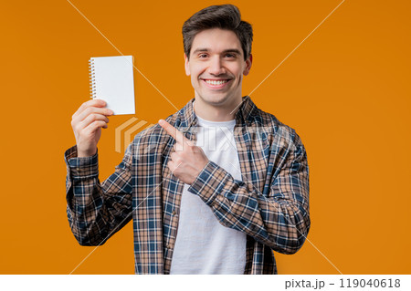 Excited smiling man. White paper notebook mockup with copy space, advertisement 119040618