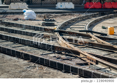 Major tram track overhaul on closed city street. Rail junction with beams, tools awaiting completion 119040900
