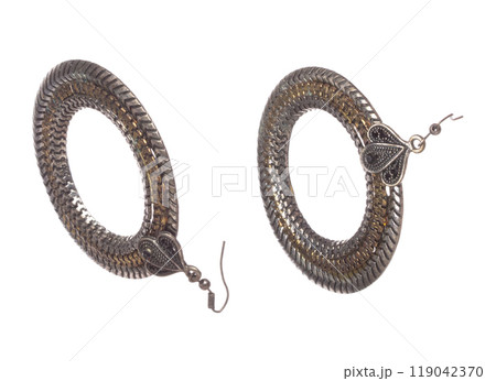 Fashion gold Earrings with beautiful work detail is value. Luxury golden earring is fashion trend and fly in air. White background isolated Fashion gold Earrings with beautiful work detail is value. Luxury golden earring is fashion trend and fly in air. White background isolated 119042370
