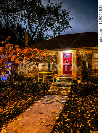 Halloween decorations in front of a house in the middle of a suburban neighborhood Halloween decorations in front of a house in the middle of a suburban neighborhood 119043639