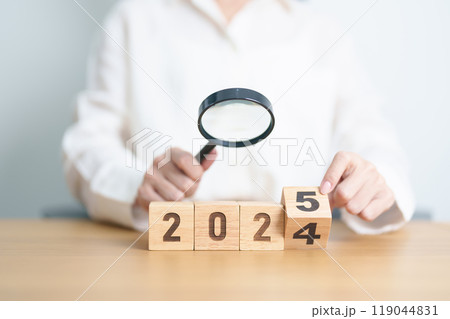2024 end year to Happy New Year 2025 with magnifying glass and people. hiring, employee, recruitment, job, SEO and jobless concept 2024 end year to Happy New Year 2025 with magnifying glass and people. hiring, employee, recruitment, job, SEO and jobless concept 119044831