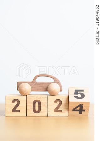 2024 end year to Happy New Year 2025 with Car model on table. Automobile Tax, Car Insurance, Financial, vehicle Repair and Maintenance and New Year concept 119044862