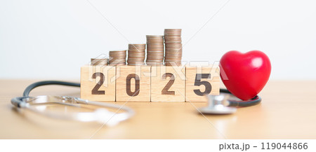 Happy New Year 2025 with doctor Stethoscope, coins stack and red heart on table. health care, Money saving, Goal, Resolution, health Insurance, Wellness and medical concept Happy New Year 2025 with doctor Stethoscope, coins stack and red heart on table. health care, Money saving, Goal, Resolution, health Insurance, Wellness and medical concept 119044866